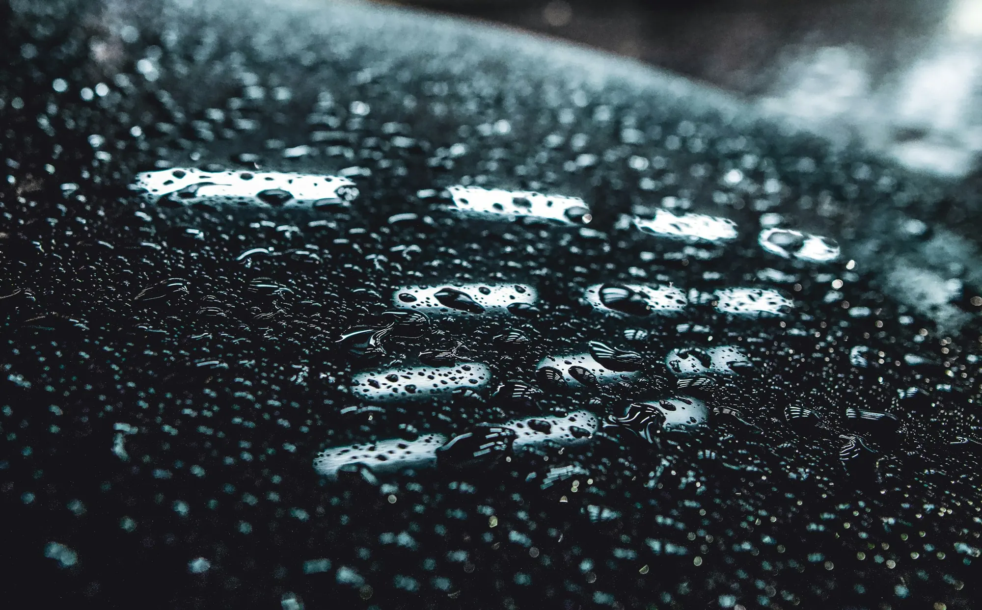 Water droplets on a black surface